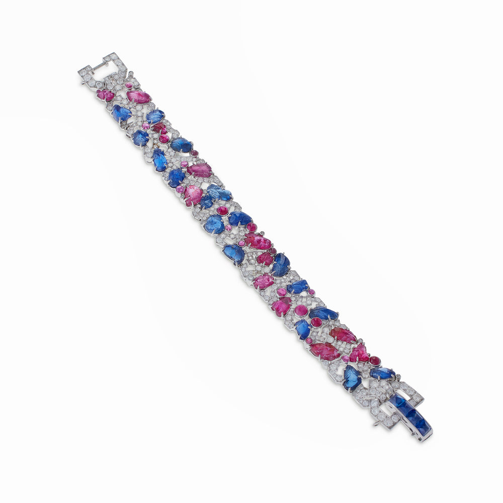 
                      
                        Macklowe Gallery Carved Ruby, Sapphire and Diamond Tutti Frutti Strap Bracelet
                      
                    