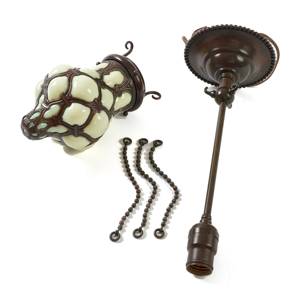 
                      
                        Macklowe Gallery Pair of Tiffany Studios New York "Globe" Glass and Bronze Chandeliers
                      
                    